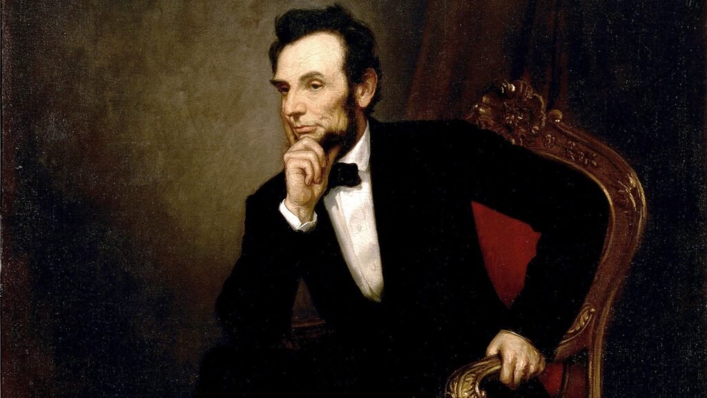 Abraham Lincoln thinking while he sits on a red chair.